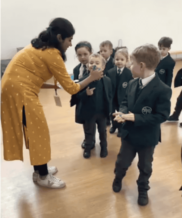 Author stood with pupils.